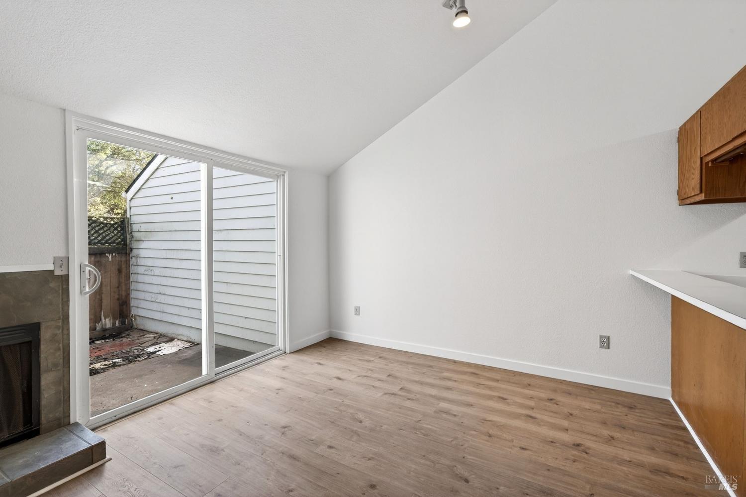 230 Courtyards East Windsor, CA 95492 - Photo 26 of 47 a view of an empty room with wooden floor and a window