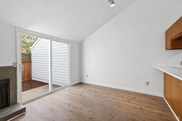 a view of empty room with fireplace