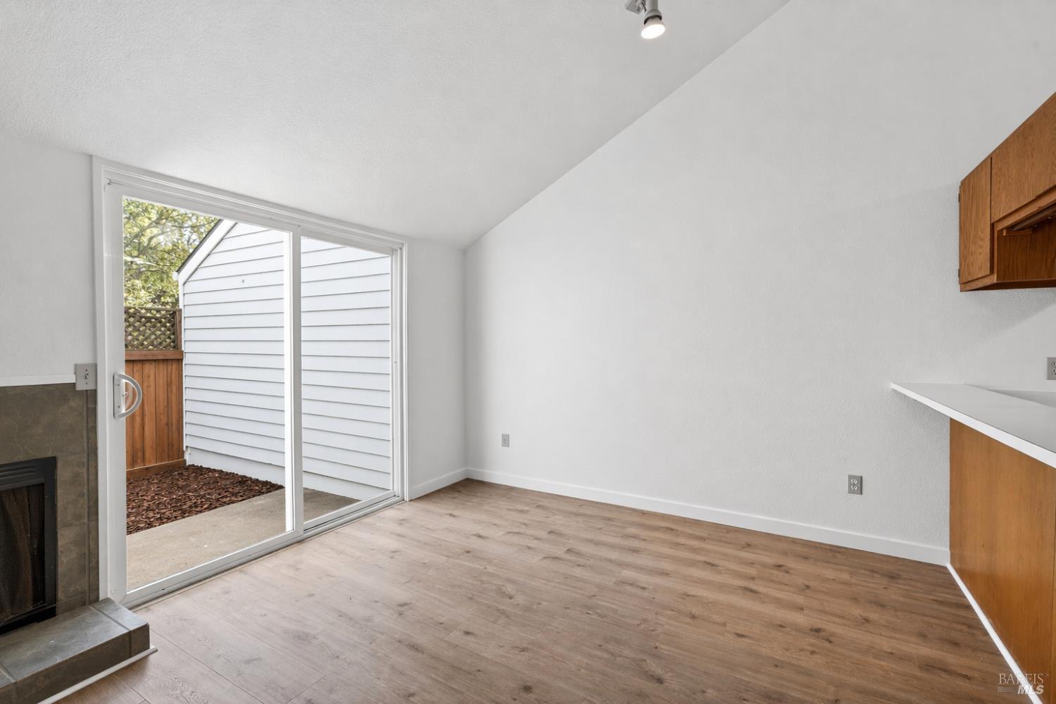230 Courtyards East Windsor, CA 95492 - Photo 27 of 47 an empty room with wooden floor and windows