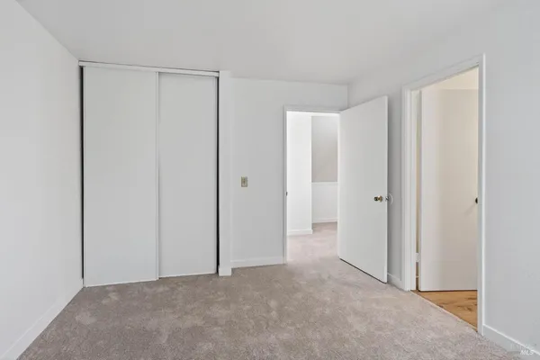 a view of a house with a door and wooden floor