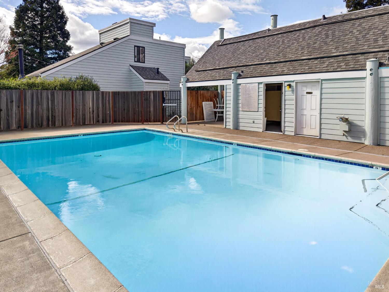 230 Courtyards East Windsor, CA 95492 - Photo 45 of 47 a view of a white house with a small yard and wooden fence