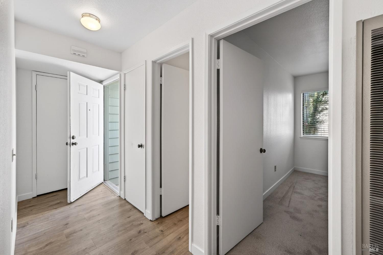 230 Courtyards East Windsor, CA 95492 - Photo 5 of 47 a view of a hallway with wooden floor