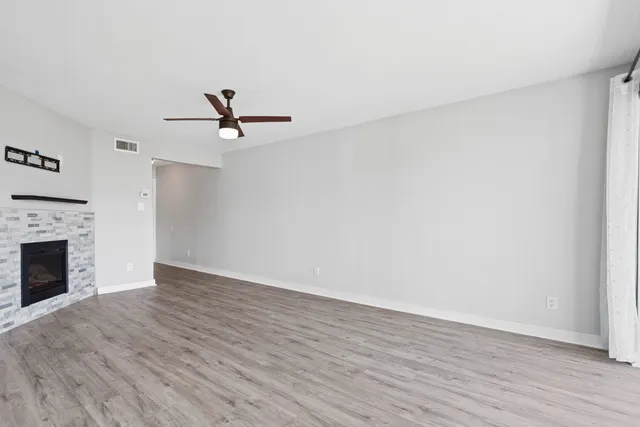 a kitchen with stainless steel appliances a refrigerator and a stove top oven