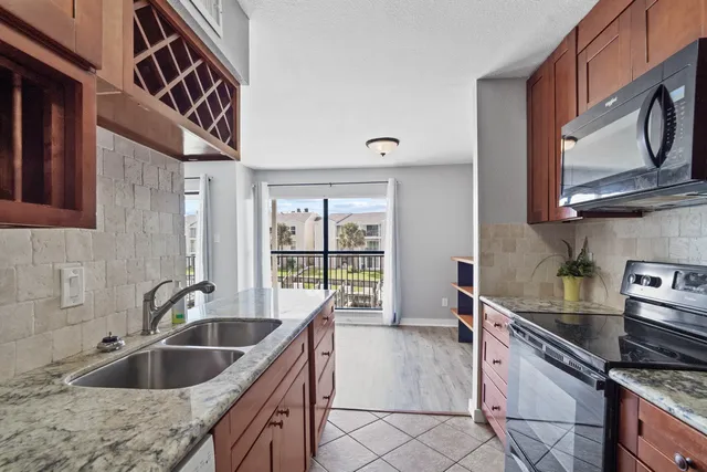a view of a room with wooden floor and a window