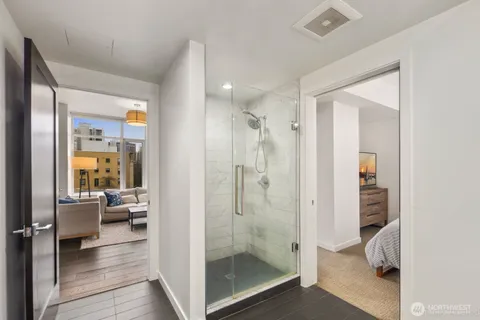 a bathroom with a glass shower door