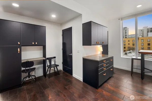 a room with furniture and wooden floor