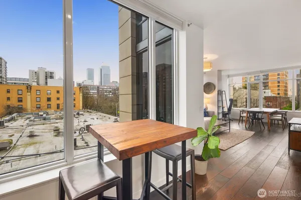 a view of a dining room with furniture window and wooden floor