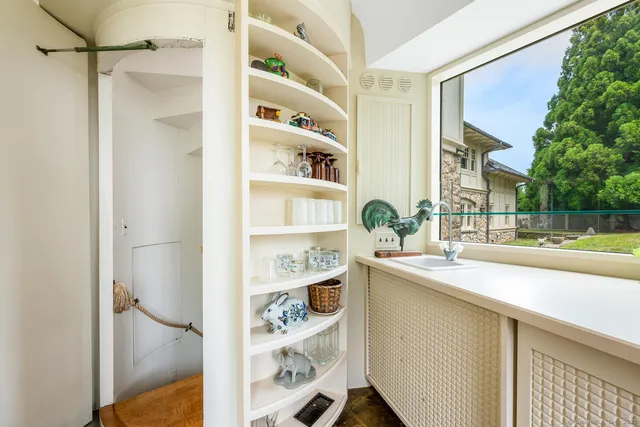 a kitchen with a refrigerator and a sink