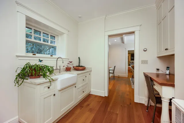 a kitchen with a sink and cabinets