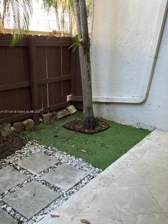 a view of a back yard of the house