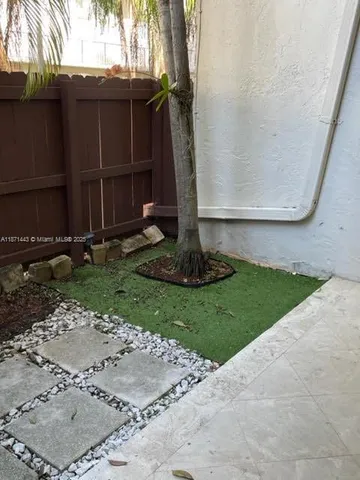 a view of a back yard of the house