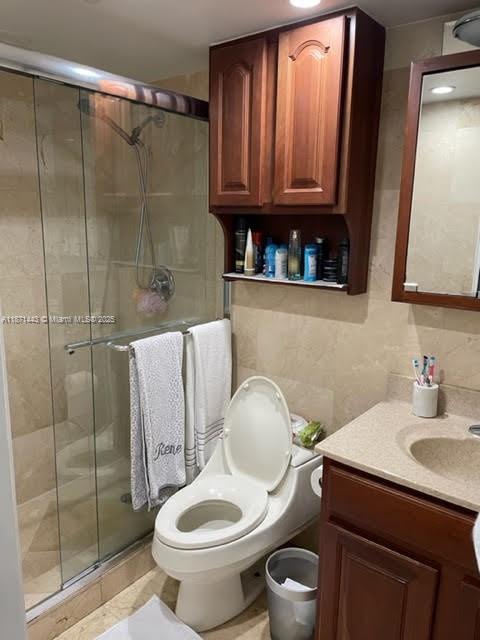 6705 North Kendall Drive, Unit 305 Pinecrest, FL 33156 - Photo 3 of 11 a bathroom with a toilet a sink and shower