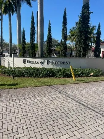 a view of swimming pool and trees