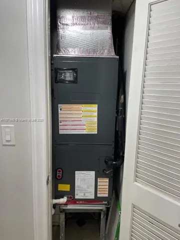 a dinning table and chairs in a room