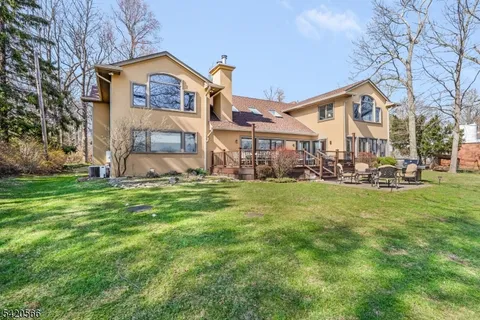 a front view of house with a garden