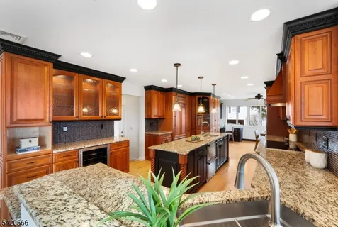 a large kitchen with a table and chairs