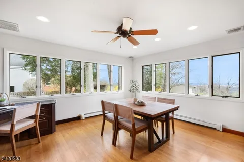 a view of a dining room with furniture window and outside view