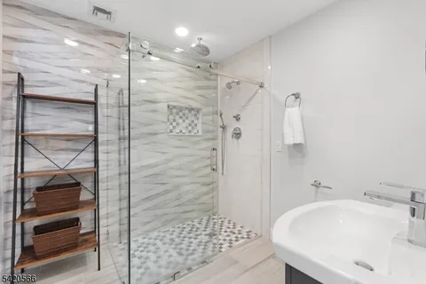 a bathroom with a bathtub and a shower