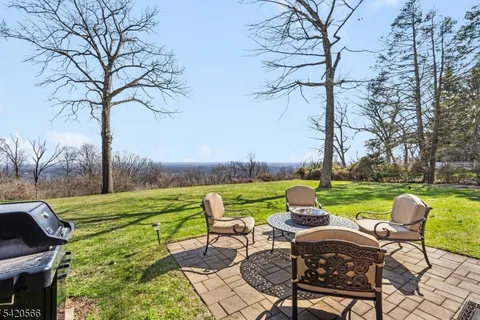 a view of a table and chairs in the garden