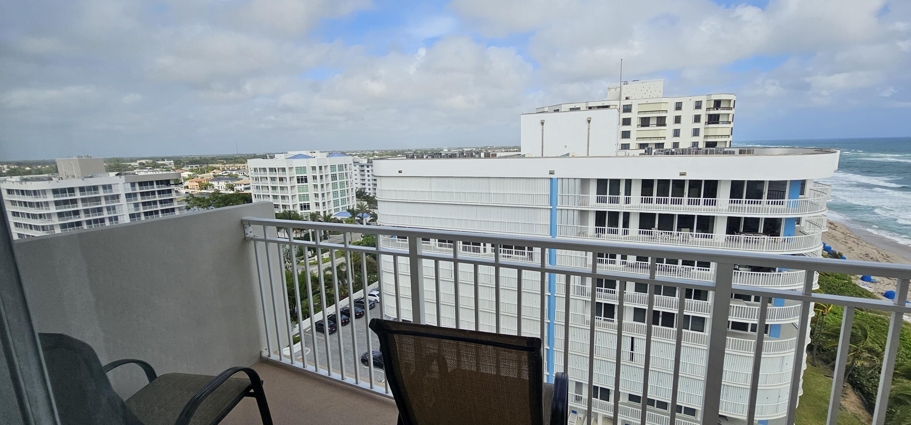 3215 South Ocean Boulevard, Unit 1010 Highland Beach, FL 33487 - Photo 13 of 23 a view of a balcony with an outdoor seating