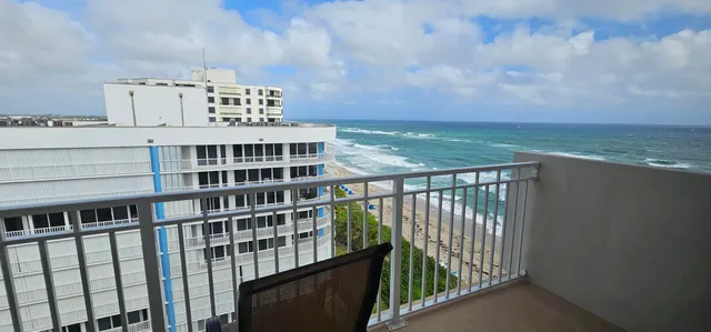 a view of a balcony with an ocean view
