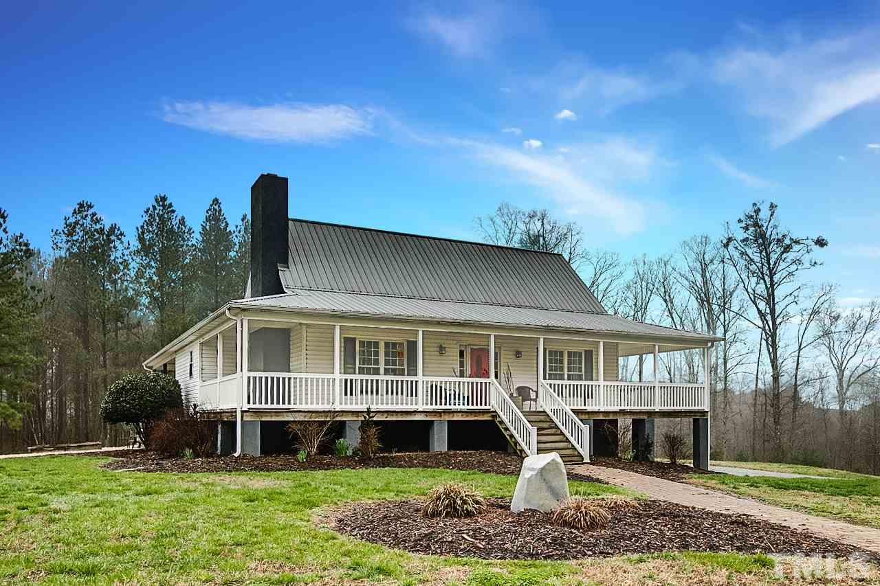 306 Charlie S Road Robbins, NC 27325 - Photo 1 of 30 a front view of a house with garden