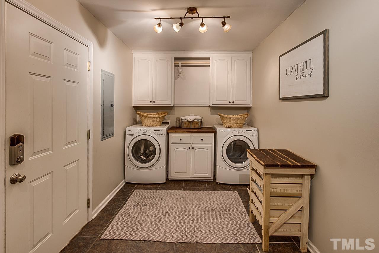 306 Charlie S Road Robbins, NC 27325 - Photo 11 of 30 a utility room with sink dryer and washer