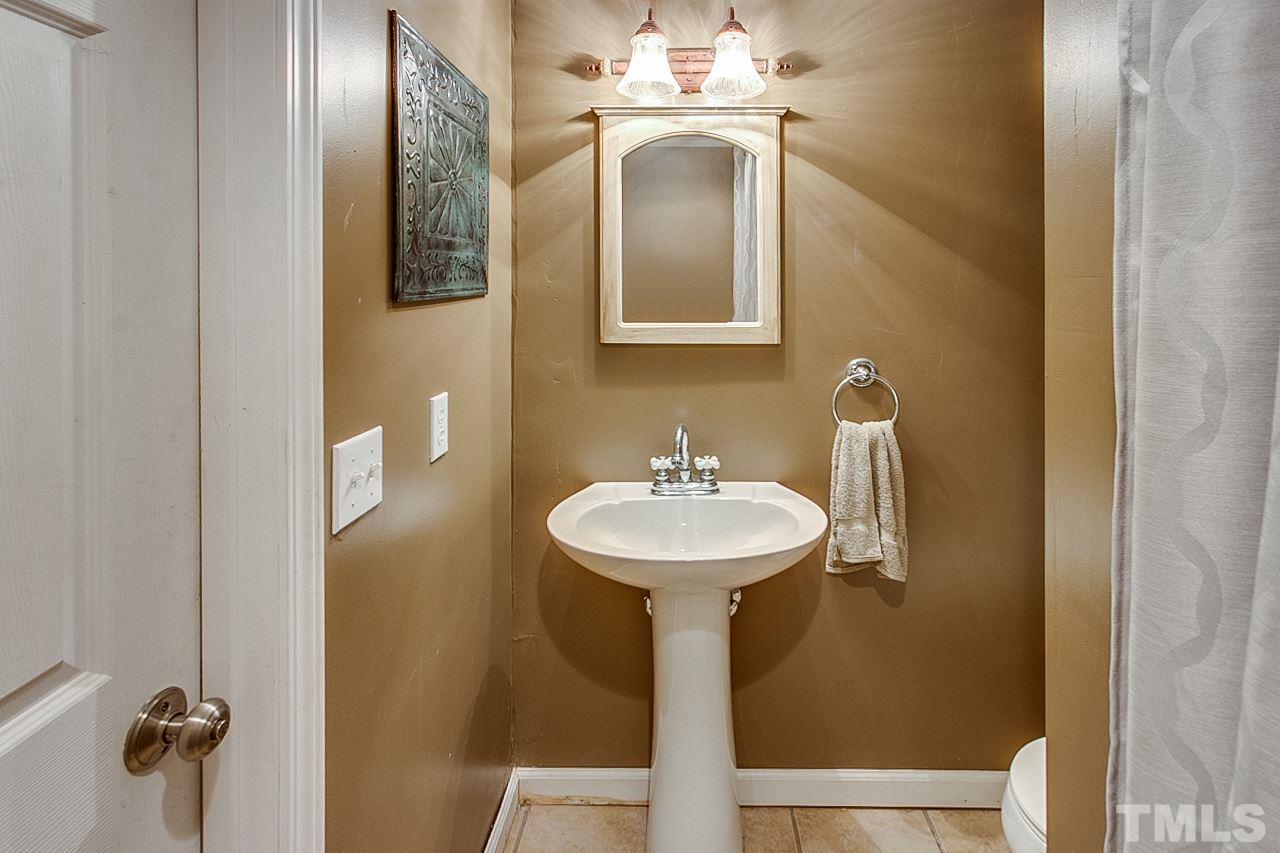306 Charlie S Road Robbins, NC 27325 - Photo 12 of 30 a bathroom with a sink a mirror and shower