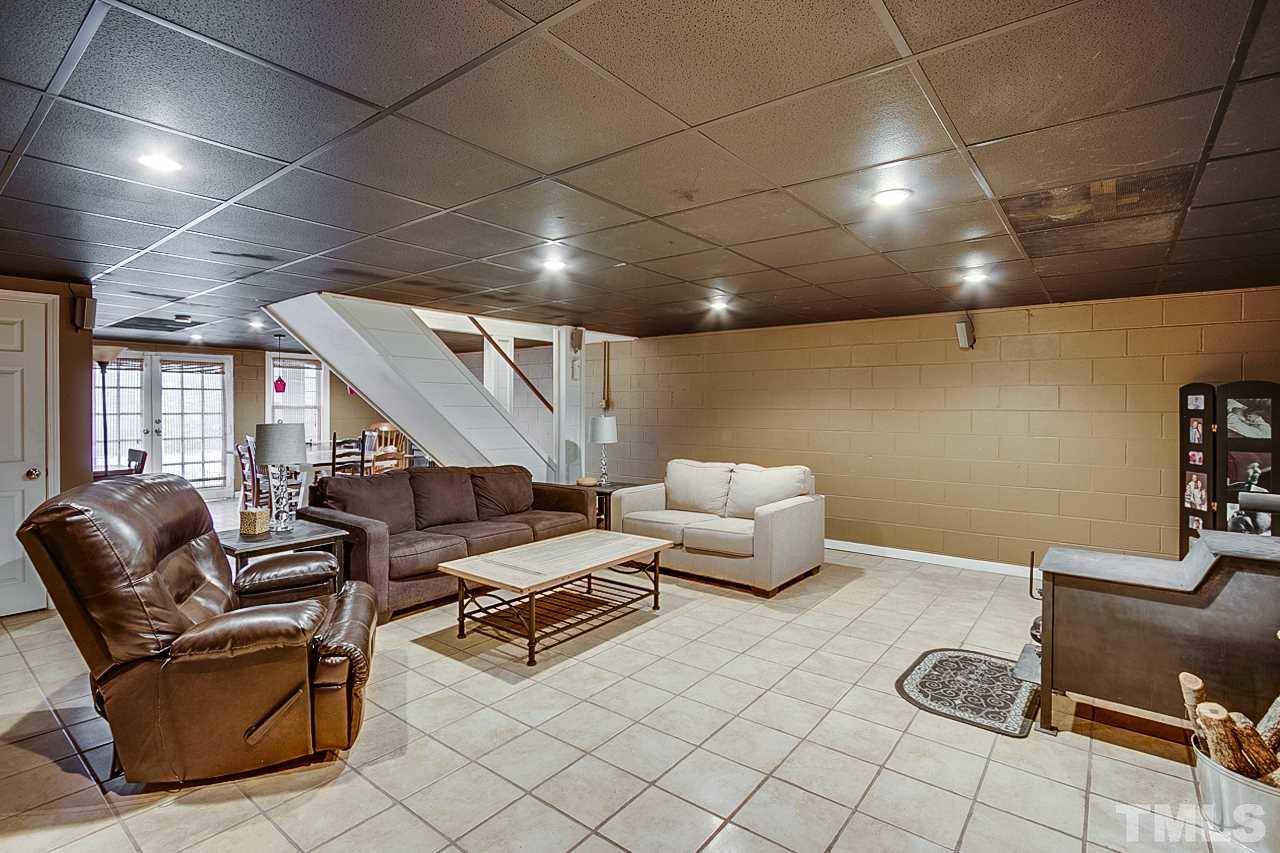 306 Charlie S Road Robbins, NC 27325 - Photo 21 of 30 a living room with furniture and a flat screen tv