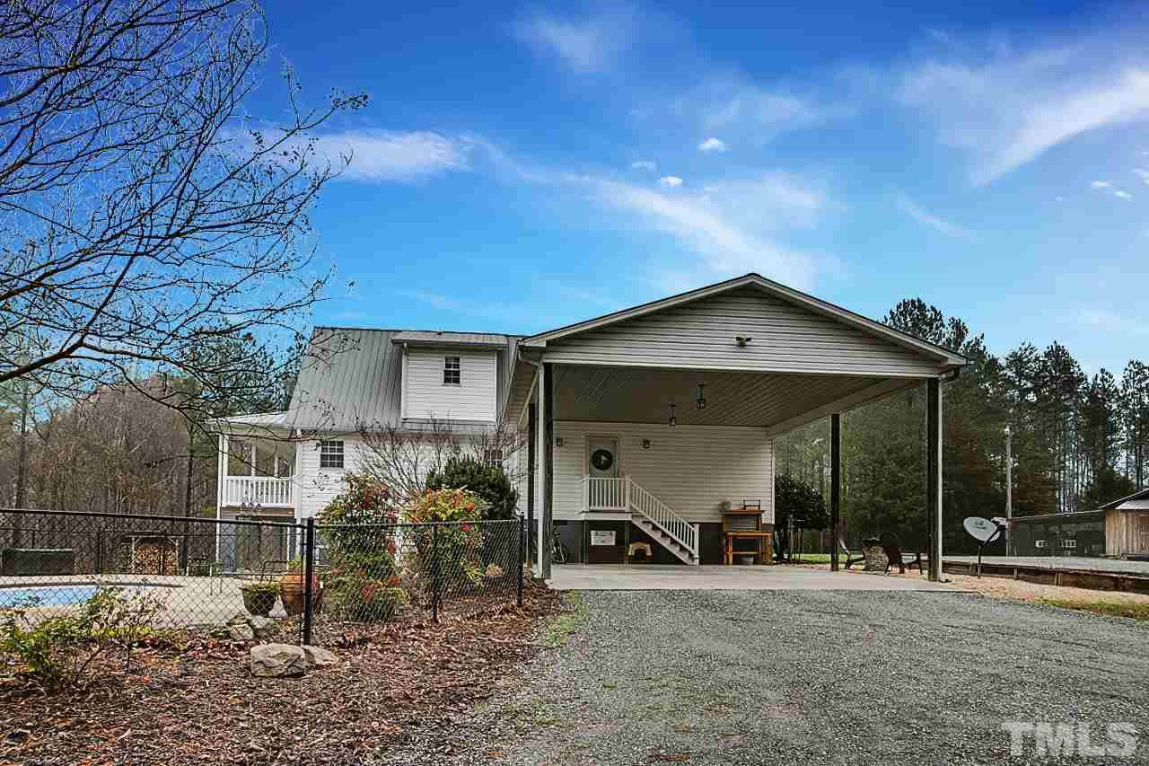 306 Charlie S Road Robbins, NC 27325 - Photo 25 of 30 a view of a house with a porch and a yard