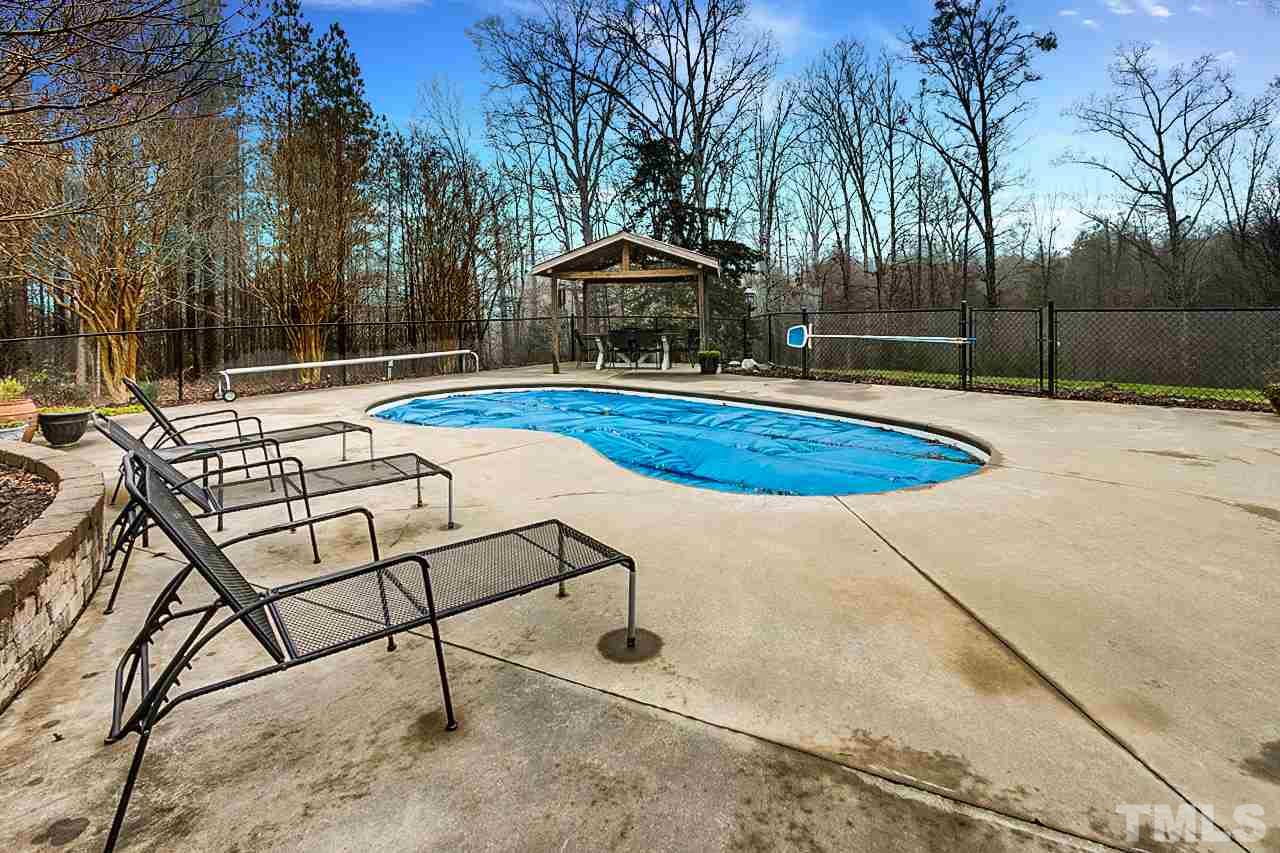 306 Charlie S Road Robbins, NC 27325 - Photo 26 of 30 a patio with a yard table and chairs
