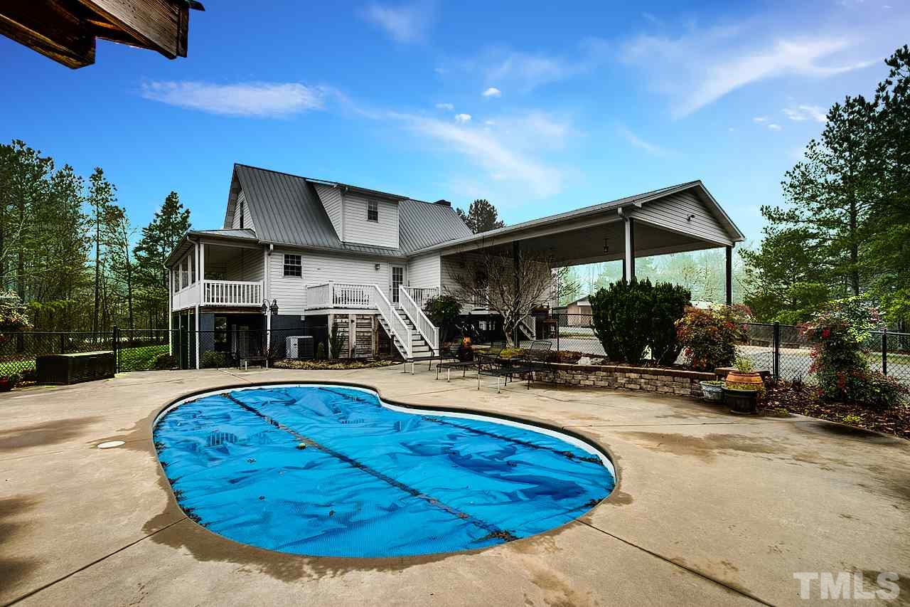 306 Charlie S Road Robbins, NC 27325 - Photo 27 of 30 a view of a house with swimming pool and sitting area