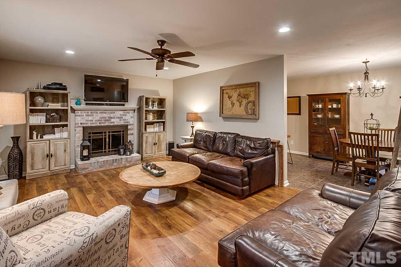 306 Charlie S Road Robbins, NC 27325 - Photo 5 of 30 a living room with fireplace furniture and a flat screen tv