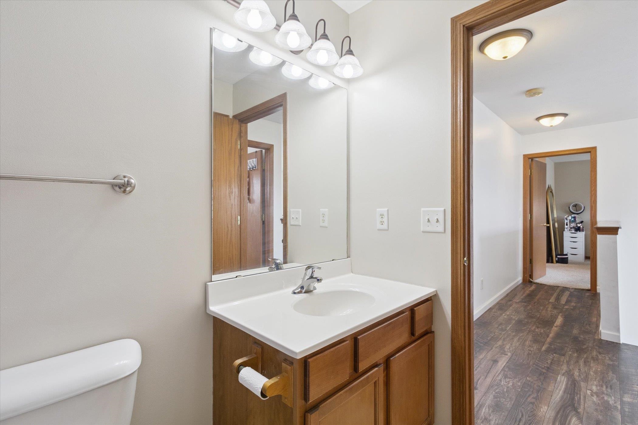 1442 Rock Island Road Davis Junction, IL 61020 - Photo 41 of 63 a bathroom with a sink a light fixture and a toilet