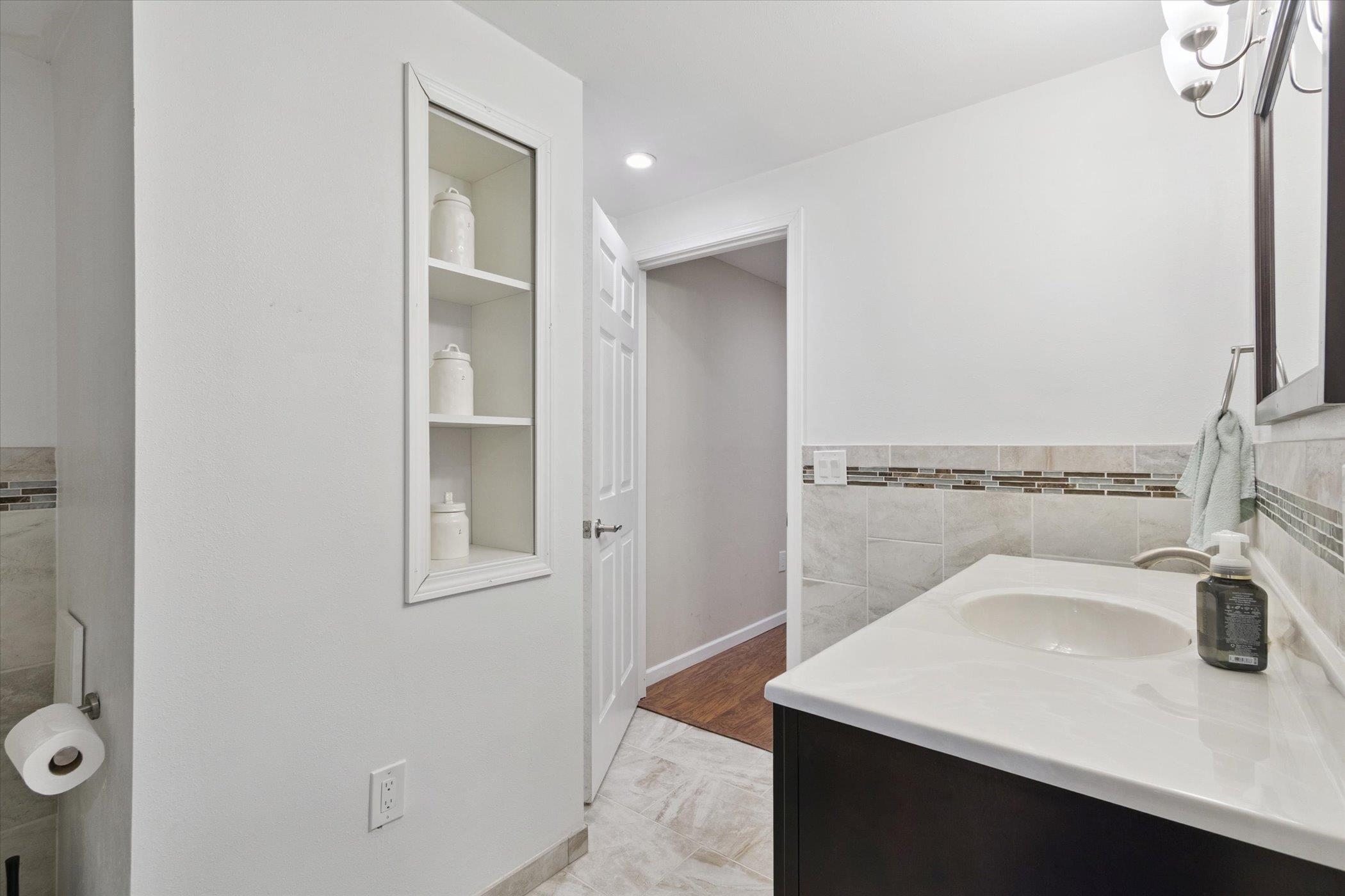 1442 Rock Island Road Davis Junction, IL 61020 - Photo 49 of 63 a bathroom with a sink and a mirror