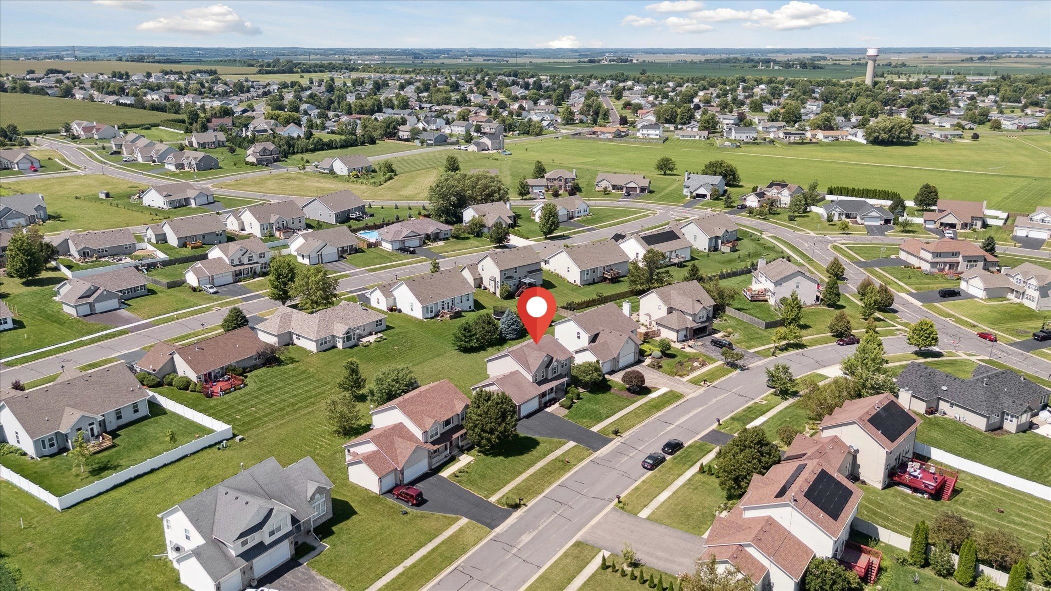 1442 Rock Island Road Davis Junction, IL 61020 - Photo 6 of 63 an aerial view of a city with lots of residential buildings ocean and mountain view in back