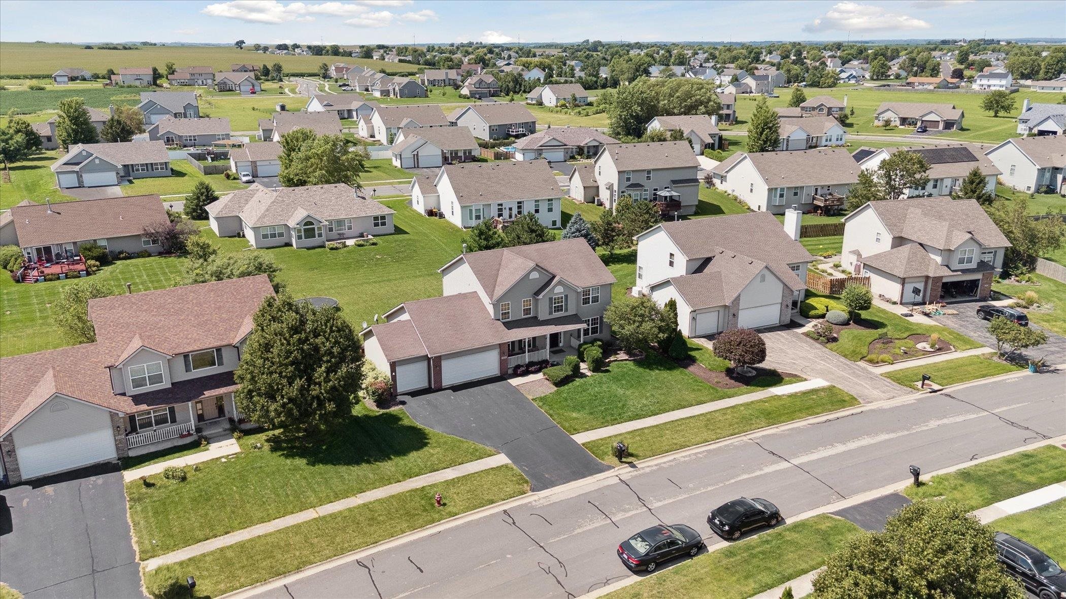 1442 Rock Island Road Davis Junction, IL 61020 - Photo 61 of 63 an aerial view of a house with a garden and houses