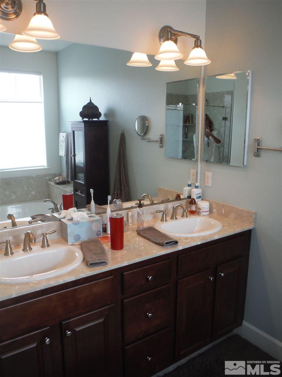 2130 Blue Oaks Drive Reno, NV 89521 - Photo 12 of 20 a bathroom with a sink and a mirror