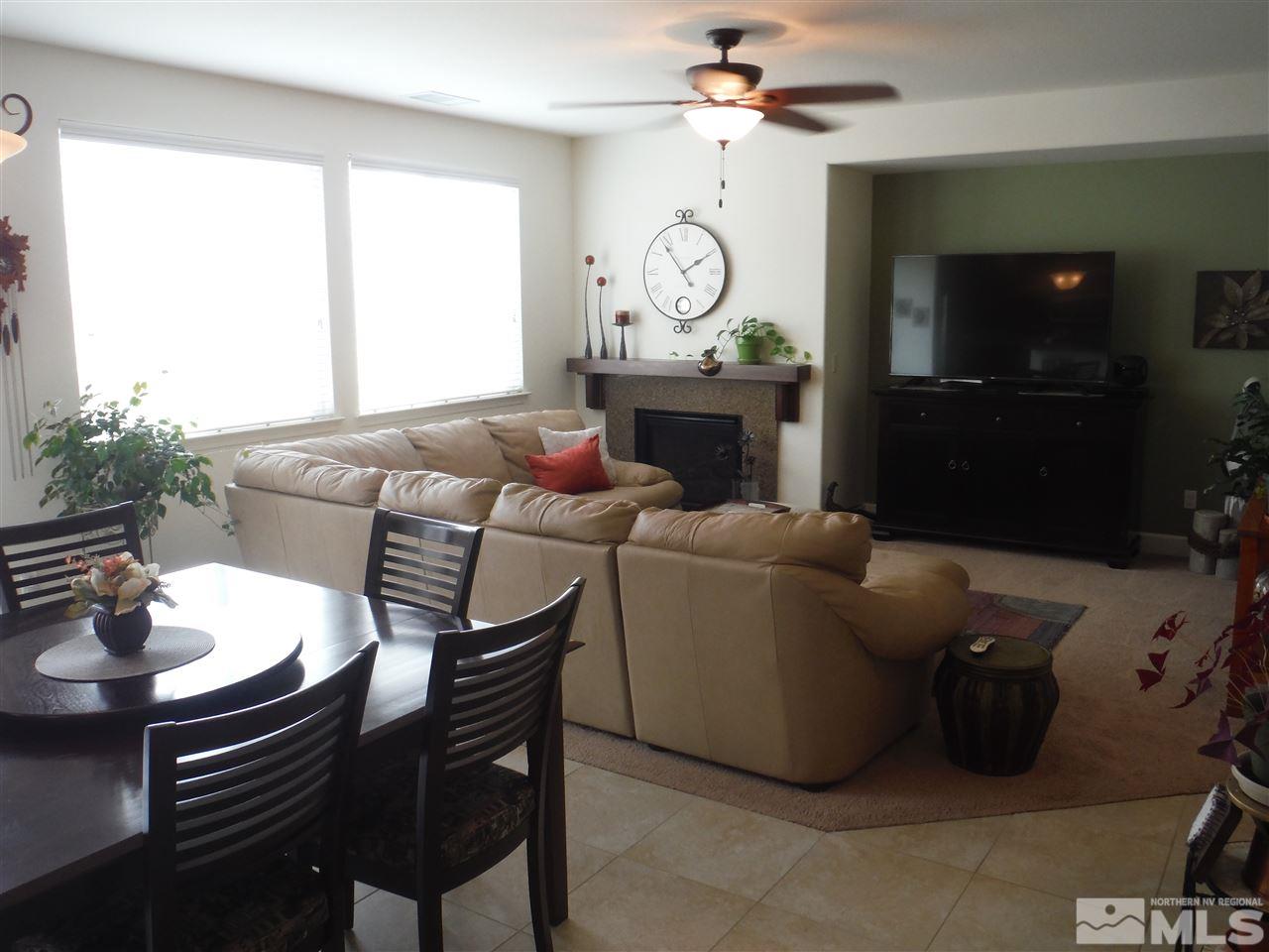 2130 Blue Oaks Drive Reno, NV 89521 - Photo 2 of 20 a living room with furniture a flat screen tv and a window