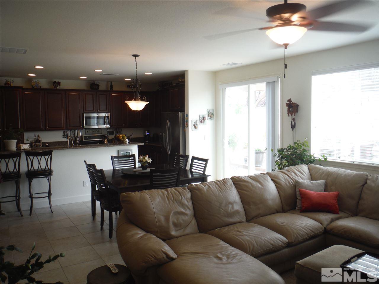 2130 Blue Oaks Drive Reno, NV 89521 - Photo 3 of 20 a living room with furniture kitchen and a chandelier