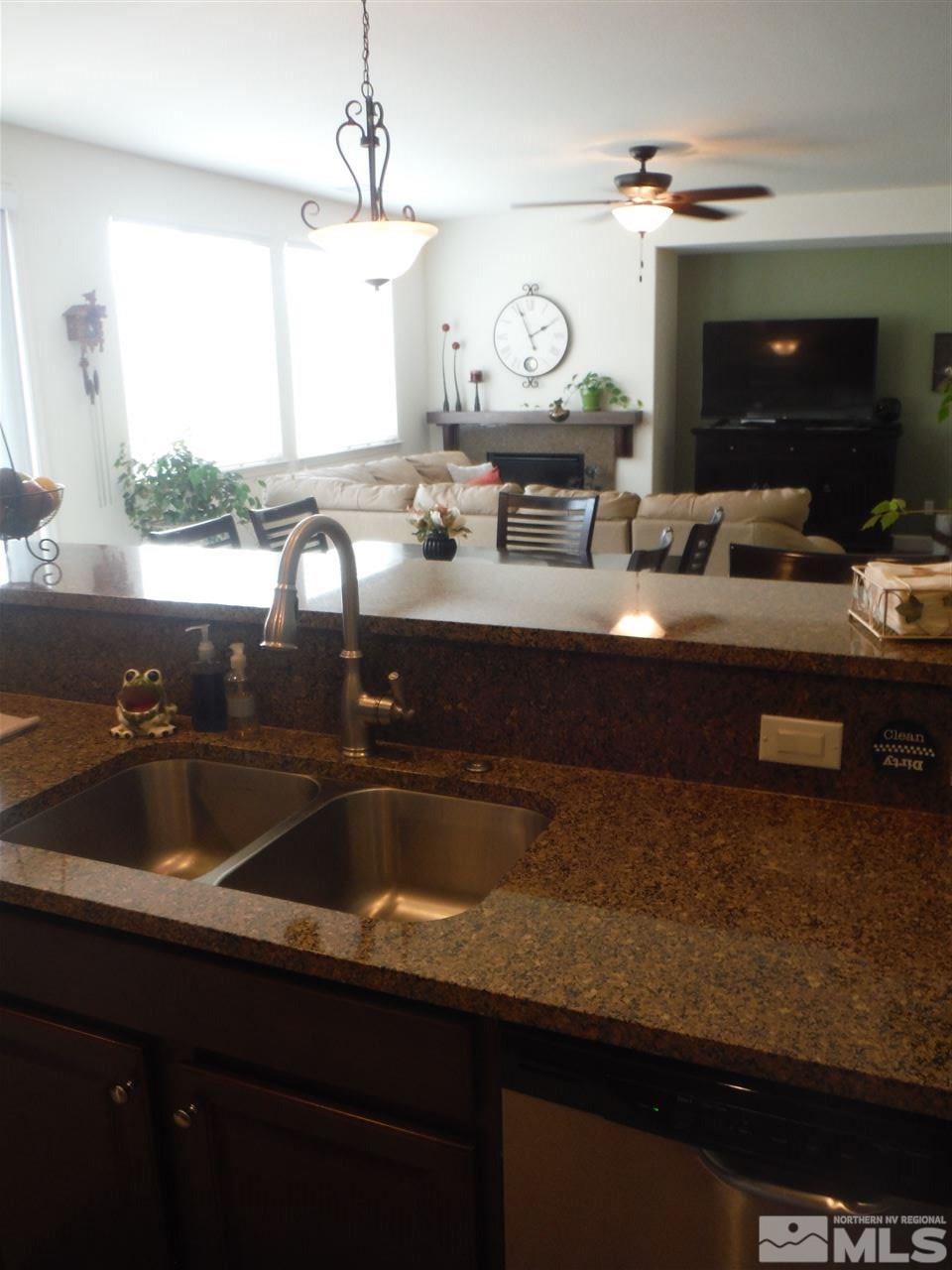 2130 Blue Oaks Drive Reno, NV 89521 - Photo 5 of 20 a kitchen with a sink and a wooden cabinets