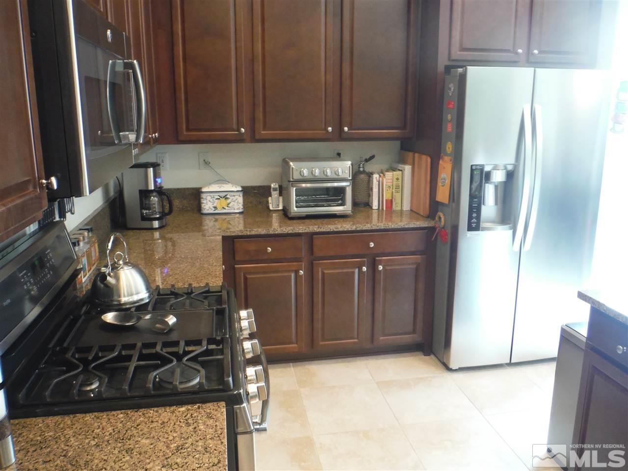 2130 Blue Oaks Drive Reno, NV 89521 - Photo 6 of 20 a kitchen with a sink and cabinets