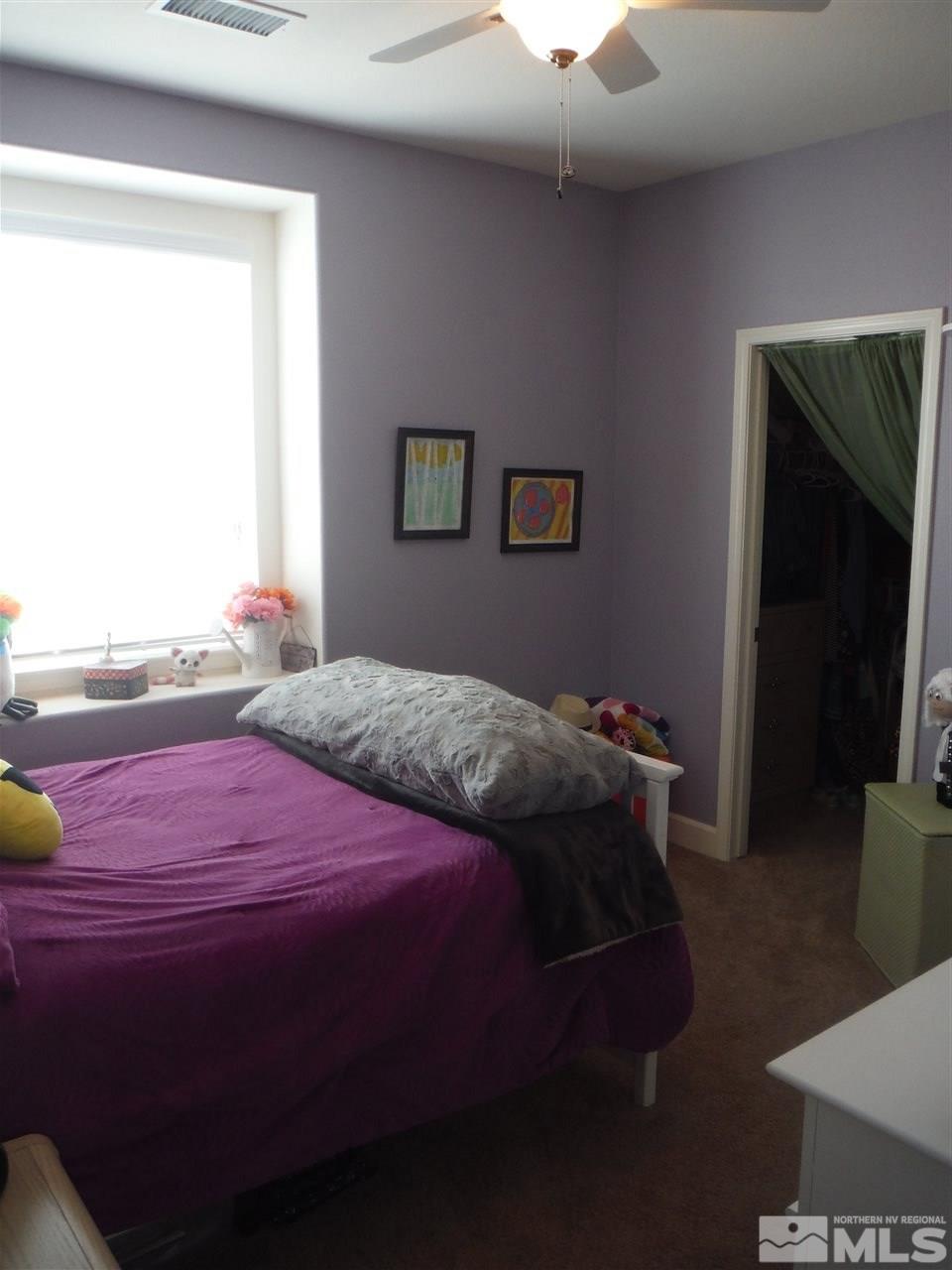 2130 Blue Oaks Drive Reno, NV 89521 - Photo 8 of 20 a bedroom with a bed and a window