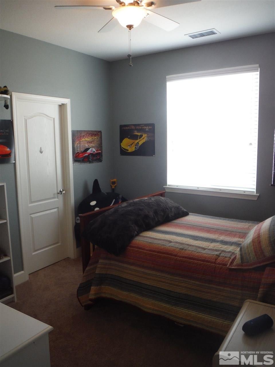 2130 Blue Oaks Drive Reno, NV 89521 - Photo 9 of 20 a bedroom with a bed and a window