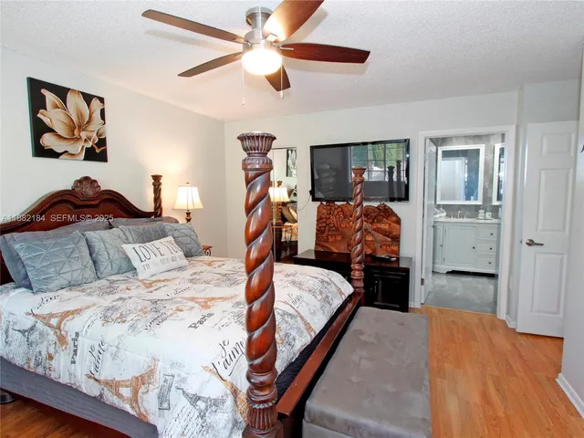 a bedroom with a bed and dresser