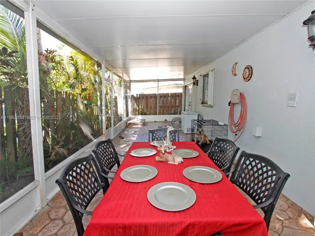 a view of a dining room with furniture window and outdoor view