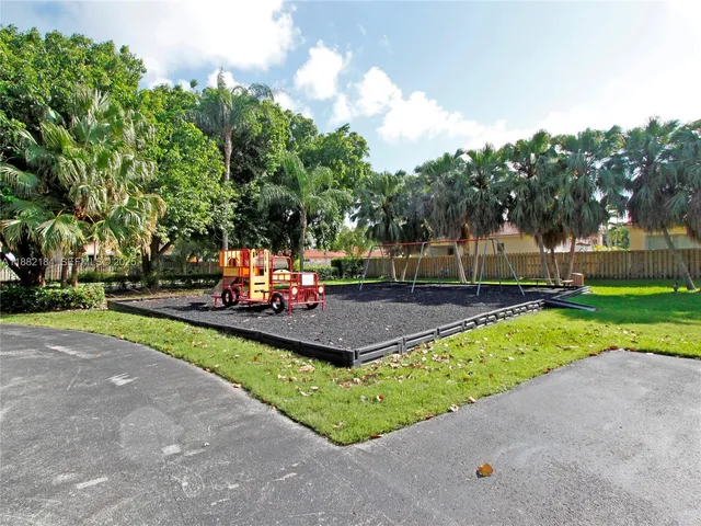 a view of a park with large trees