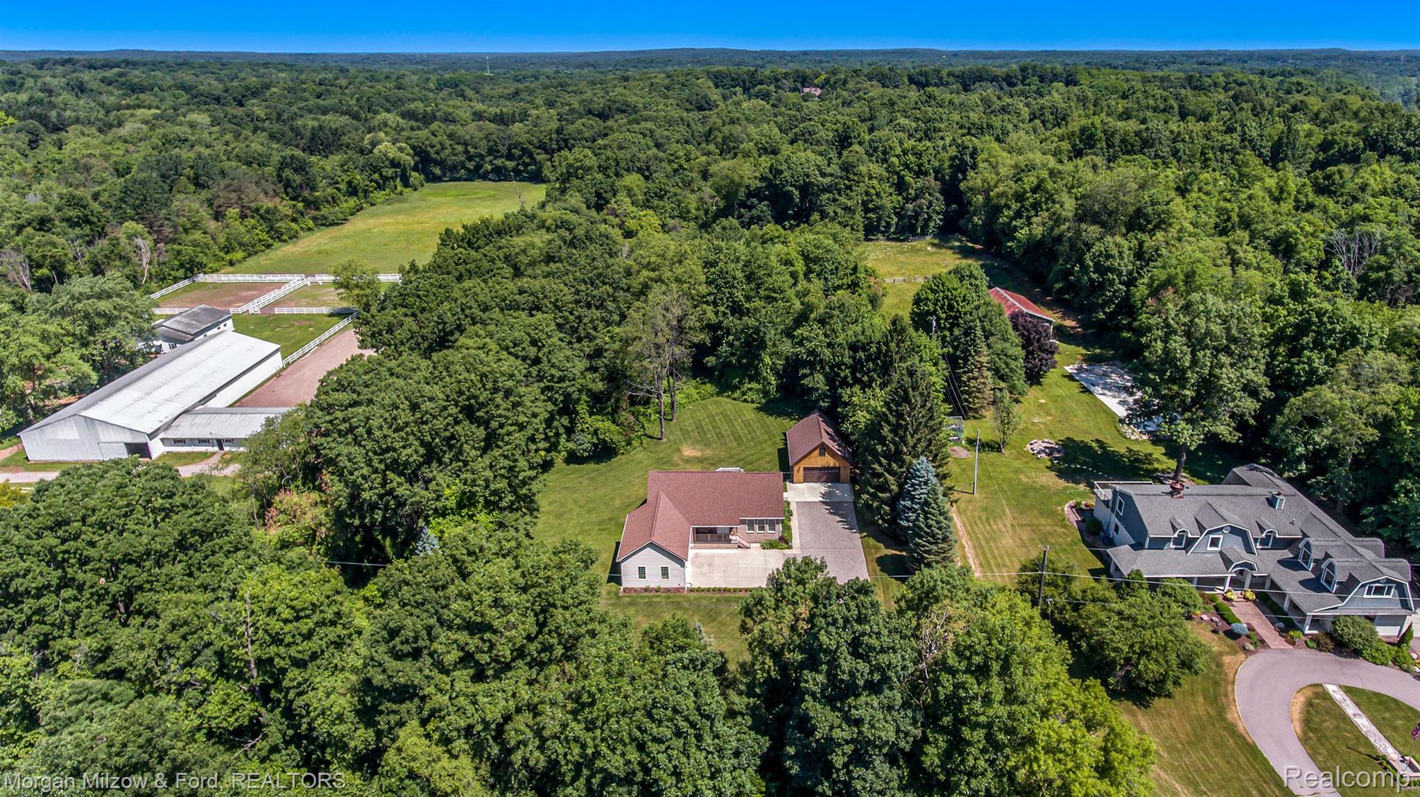 9647 Hadley Road Clarkston, MI 48348 - Photo 2 of 31 Towering trees envelope this prime package