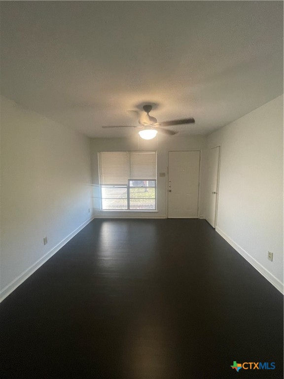 1605 Bexar Avenue Victoria, TX 77901 - Photo 2 of 12 a view of wooden floor and windows in a room
