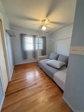 a room with furniture and wooden floor